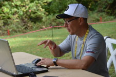 At the USDGC Munukka has been involved in scoring and the Metrix stats. Here he is stationed by Hole 18.